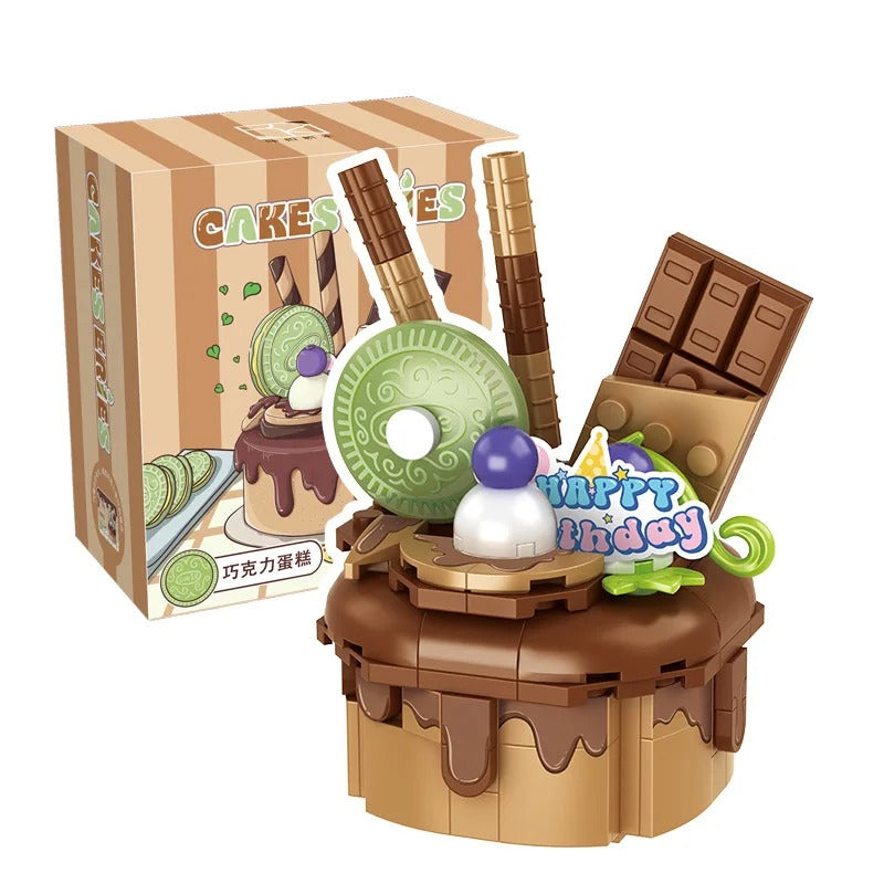 A whimsical chocolate birthday cake toy with playful toppings, a cheerful 'Happy Birthday' sign, and a replica cake box in the background, perfect for celebrating special occasions.