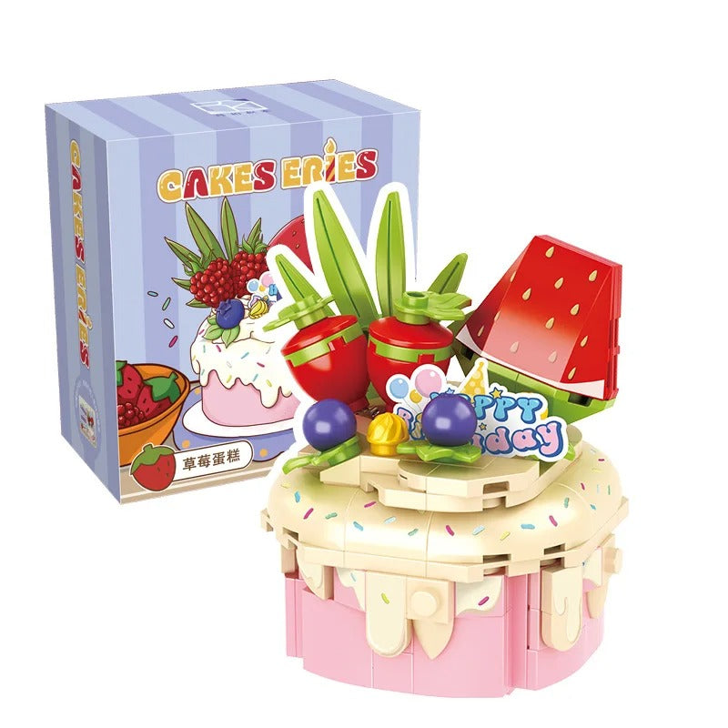 A playful toy cake set with vibrant fruits, colorful details, and a cheerful "Happy Birthday" sign, presented beside its packaging. Perfect for imaginative celebrations!