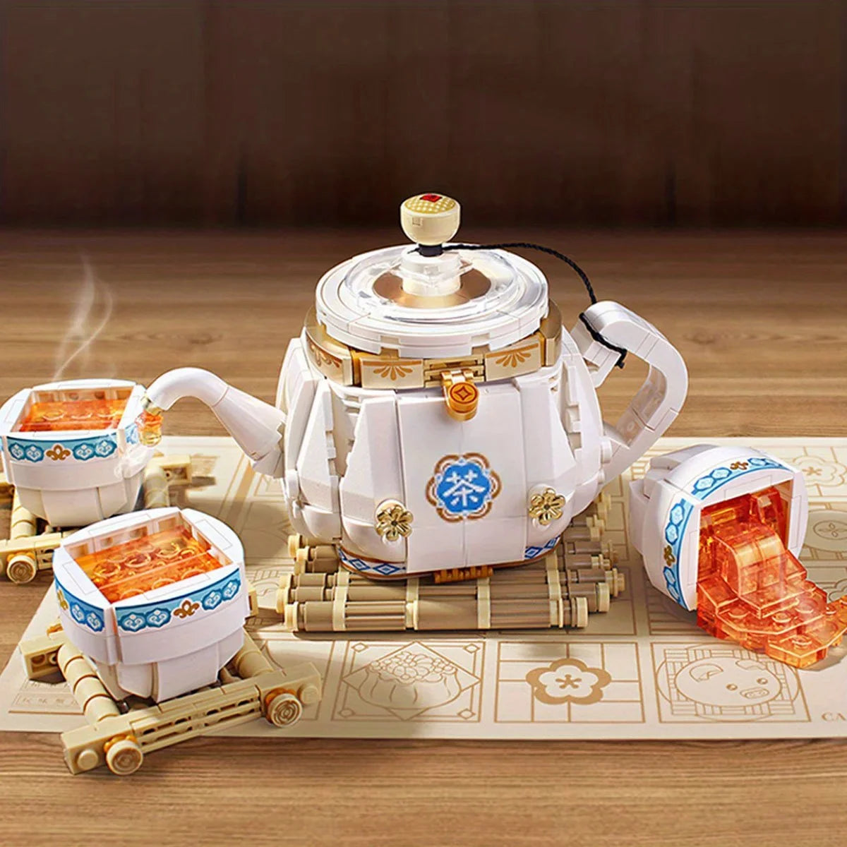 Delight in this charming LEGO-style tea set, featuring a whimsical teapot and cups on a bamboo mat, perfect for a playful tea-time.